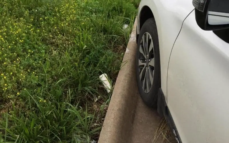 What kind of damage can hitting a curb cause